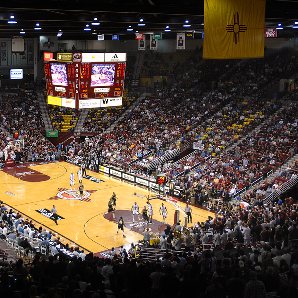The Pan American Center packed with Aggie fans at a men's basketball game.