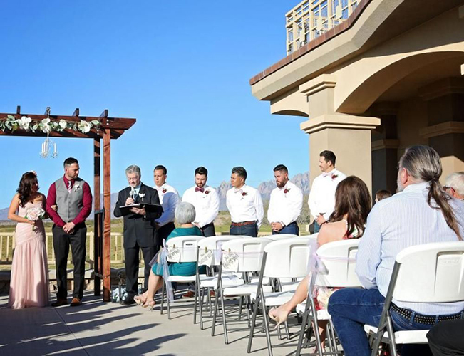 Outdoor wedding on an outside patio.