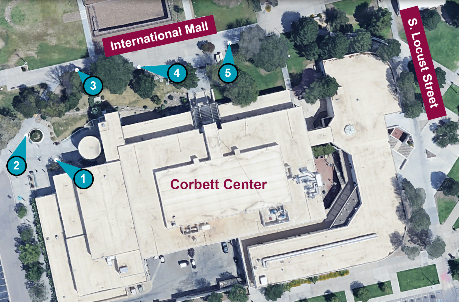 An aerial photo of Corbett Center. Five number markers indicate designated locations for tabling outside of Corbett Center.